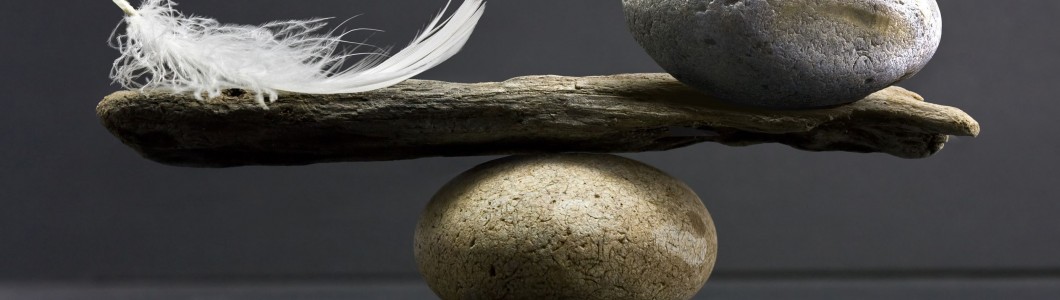 a feather and a stone equally balance